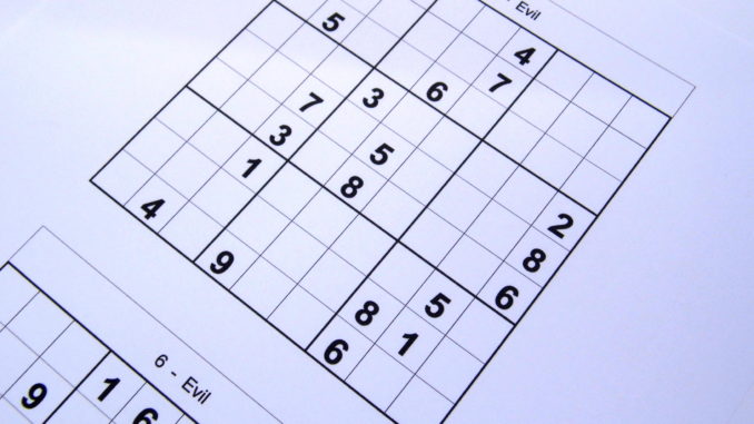 Sudoku puzzle book opened and ready to start