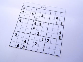 Evil level sudoku puzzle book at the beginning