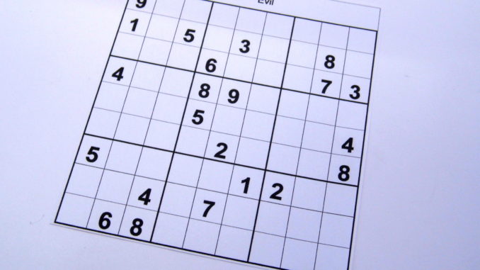 Evil level sudoku puzzle book at the beginning