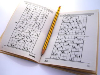 Sudoku puzzle book opened and ready to start