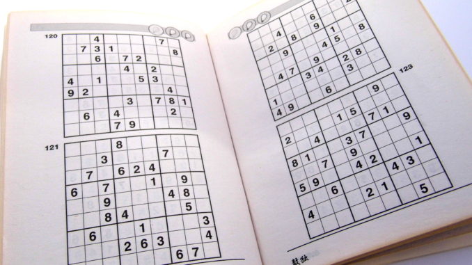Sudoku puzzle book on page 70